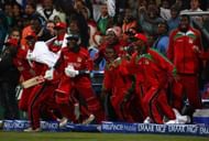 Zimbabwe players join their team-mates in celebrating their historic win against Australia